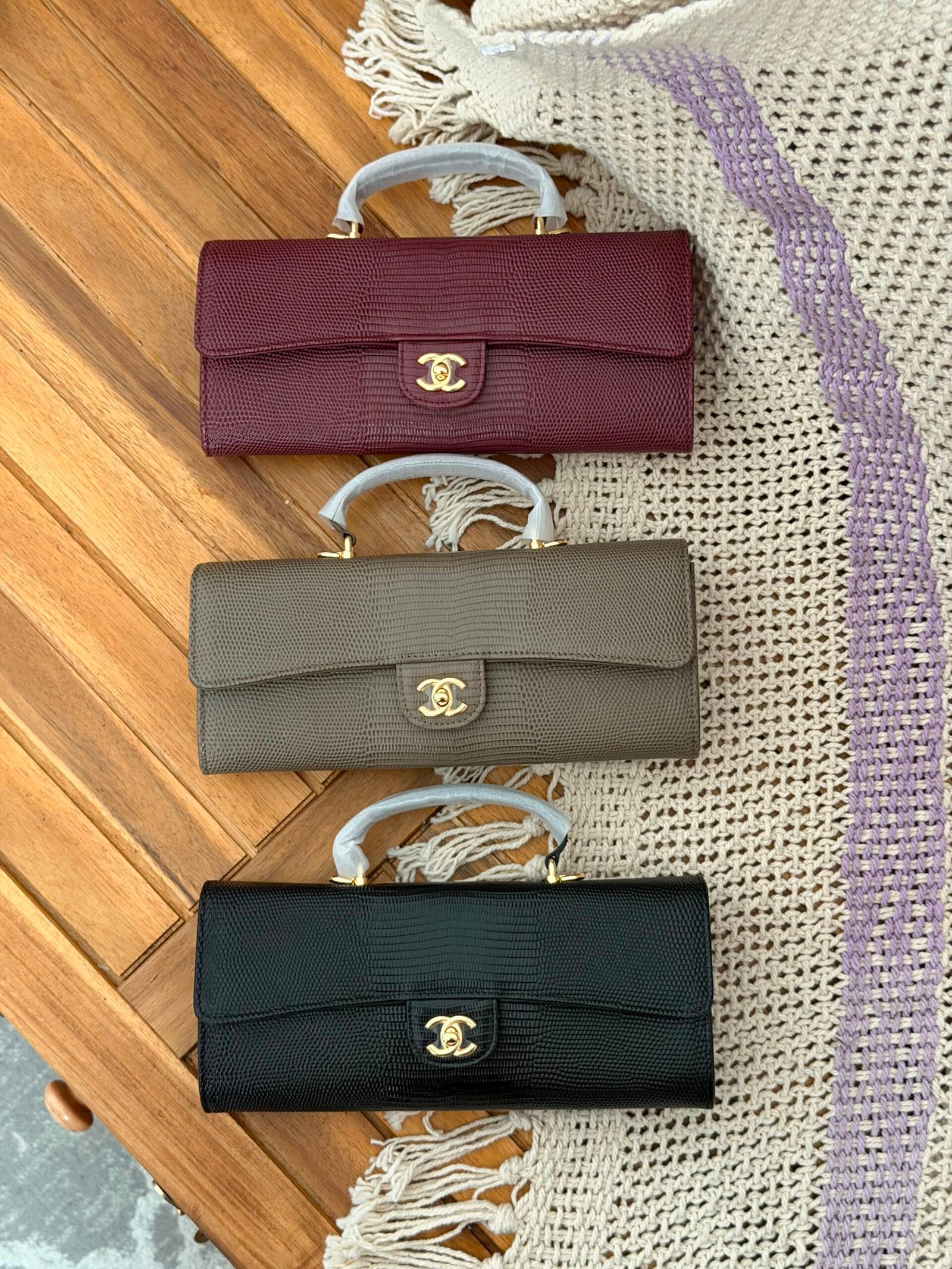 WhatsApp Image 2026-07-27 at 03.02.13 Chanel Lizard Embossed Calfskin Top Handle Long Clutch with iconic gold tone CC lock - Image 1