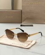 Bvlgari BV6191-B-D sunglasses a rimless, cat-eye design with golden metal accents - Image 2