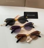 Bvlgari BV6191-B-D sunglasses a rimless, cat-eye design with golden metal accents