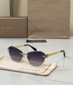 Bvlgari BV6191-B-D sunglasses a rimless, cat-eye design with golden metal accents - Image 3