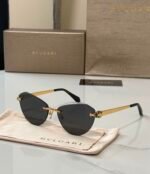 Bvlgari BV6191-B-D sunglasses a rimless, cat-eye design with golden metal accents - Image 4