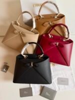 Dior Cigale Bag structured architectural silhouette in shiny supple calfskin accented with a delicate front bow detail