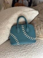 Hermès Baseball Bolide 45 bags in textured Evercolor leather showcase playful contrast-stitched lacing - Image 3