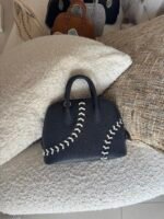 Hermès Baseball Bolide 45 bags in textured Evercolor leather showcase playful contrast-stitched lacing - Image 2
