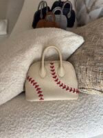 Hermès Baseball Bolide 45 bags in textured Evercolor leather showcase playful contrast-stitched lacing - Image 4