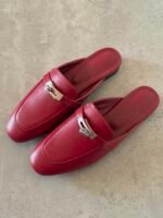 Hermès Oz Mules in goatskin with the iconic palladium-plated kelly buckle