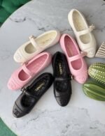 Chanel Quilted Leather Mary Jane flats with signature interlocking CC logo