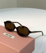 Miu Miu Oval Acetate Sunglasses (Model: SMU04Z / MU 04ZS) - Image 2