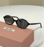 Miu Miu Oval Acetate Sunglasses (Model: SMU04Z / MU 04ZS) - Image 4